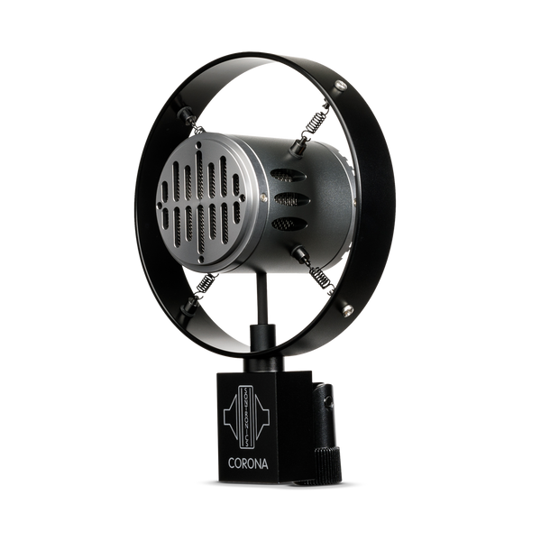 Image on white background of a Sontronics Corona microphone with its recognisable Art Deco styling and outer ring with four springs design, facing to the left